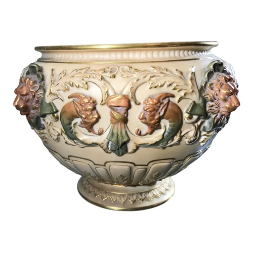 135 - ROYAL WORCESTER, A LARGE EDWARDIAN BLUSH IVORY JARDINIÈRE 
Moulded in Renaissance style with four li... 