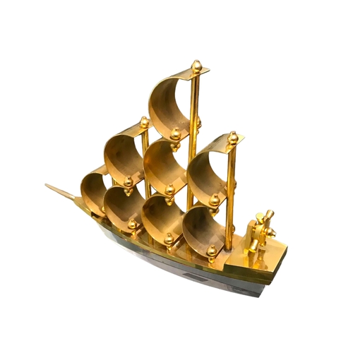 143 - A 20TH CENTURY CONTEMPORARY GILT BOAT SCULPTURE ON LUCITE BASE. 
(h 19.5cm x w 26.5cm x depth 6.1cm)