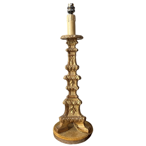 154 - THREE 18TH CENTURY ITALIAN WALNUT, GILTWOOD AND POLYCHROME CANDLESTICKS CONVERTED TO LAMPS.
(largest... 