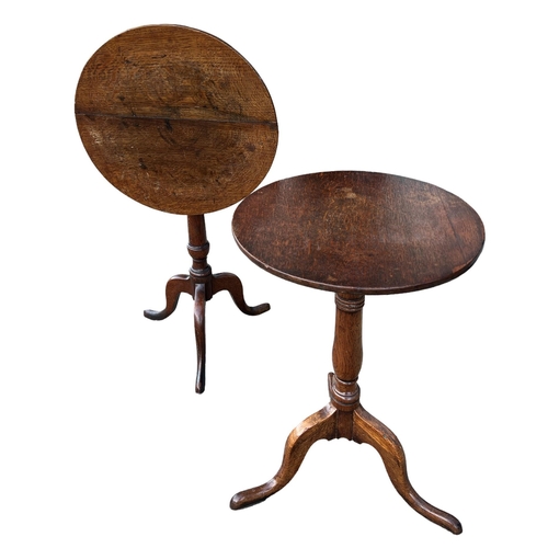 155A - TWO 18TH CENTURY OAK CIRCULAR OCCASIONAL TRIPOD TABLES
Supported on turned columns, raised on three ... 