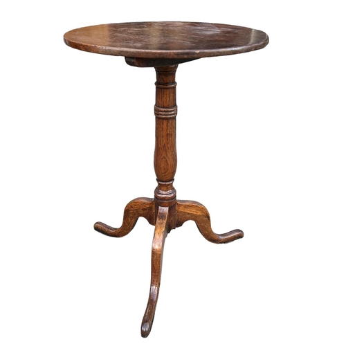 155A - TWO 18TH CENTURY OAK CIRCULAR OCCASIONAL TRIPOD TABLES
Supported on turned columns, raised on three ... 