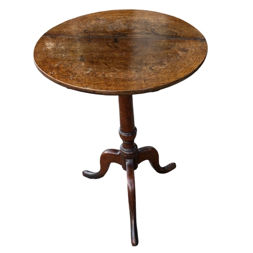 155A - TWO 18TH CENTURY OAK CIRCULAR OCCASIONAL TRIPOD TABLES
Supported on turned columns, raised on three ... 