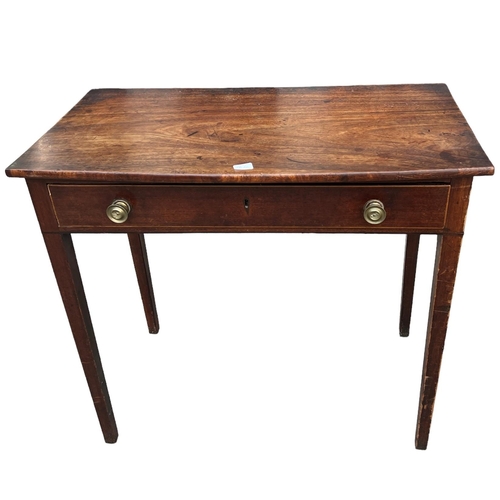 161A - A GEORGE III MAHOGANY AND LINE INLAID BOW FRONTED SIDE TABLE
With single drawer, raised on square ta... 