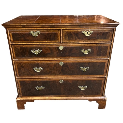 164A - AN 18TH CENTURY WALNUT AND HERRINGBONE INLAID CHEST OF DRAWERS
With quarter veneer top above two sho... 