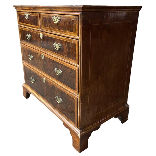 164A - AN 18TH CENTURY WALNUT AND HERRINGBONE INLAID CHEST OF DRAWERS
With quarter veneer top above two sho... 