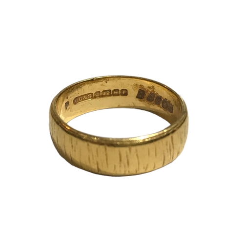 54A - CHARLES GREEN & SON LTD, A 22CT GOLD TEXTURED BAND Hallmarked Birmingham, 1968. 
(UK ring size P½, 7... 