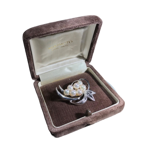 62A - MIKIMOTO, TOKYO, A BOXED VINTAGE SILVER AND PEARL BROOCH
Naturalistic form, consisting of seven lust... 