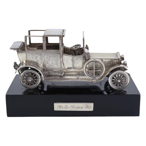 56 - A SOLID SILVER ROLLS-ROYCE 1911 SILVER GHOST SCULPTURE
Mounted on black base, hallmarked Spanish Sil... 