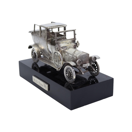 56 - A SOLID SILVER ROLLS-ROYCE 1911 SILVER GHOST SCULPTURE
Mounted on black base, hallmarked Spanish Sil... 