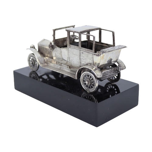 56 - A SOLID SILVER ROLLS-ROYCE 1911 SILVER GHOST SCULPTURE
Mounted on black base, hallmarked Spanish Sil... 