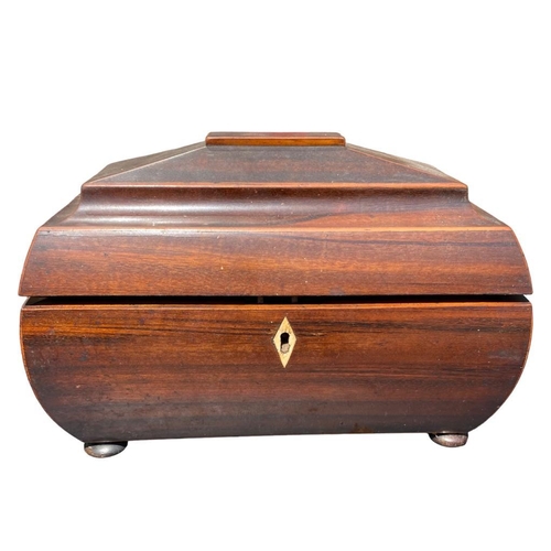 80 - A 19TH CENTURY WOODEN TEA CADDY
Having felt buttoned interior, raised on four bun feet.