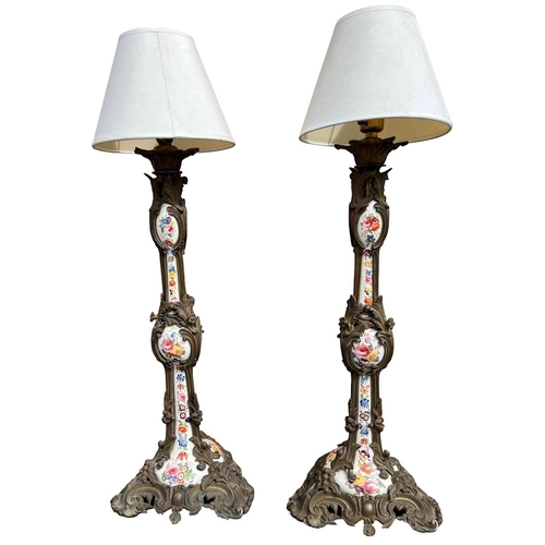 82 - A PAIR OF LARGE 19TH CENTURY FRENCH BRONZE AND HAND PAINTED PORCELAIN LAMPS
With scrolling foliage a... 