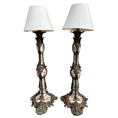 82 - A PAIR OF LARGE 19TH CENTURY FRENCH BRONZE AND HAND PAINTED PORCELAIN LAMPS
With scrolling foliage a... 