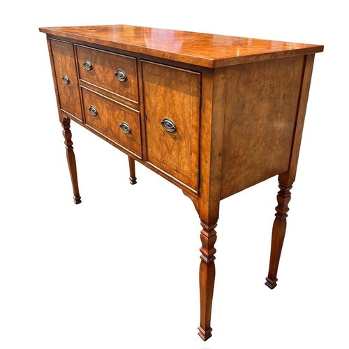 126 - A GEORGE III DESIGN WALNUT SIDEBOARD
With two central drawers flanked by two cupboard doors, raised ... 