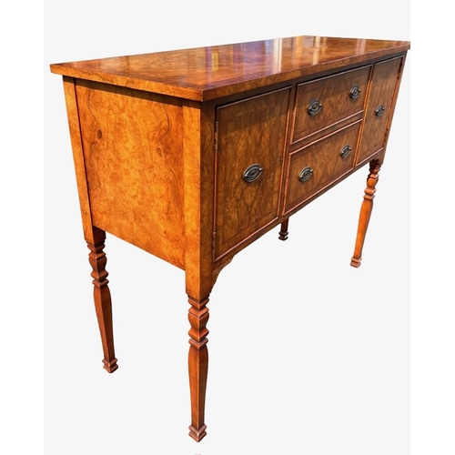 126 - A GEORGE III DESIGN WALNUT SIDEBOARD
With two central drawers flanked by two cupboard doors, raised ... 