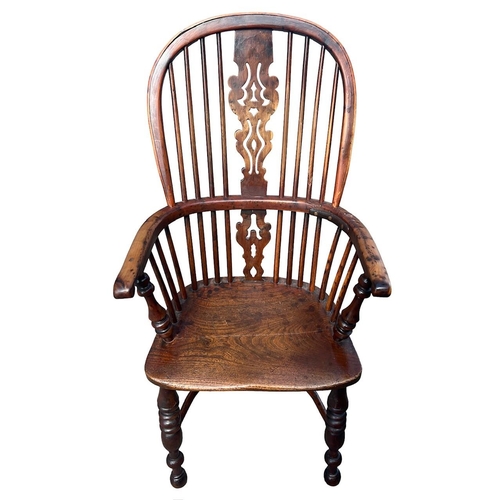 140 - A 19TH CENTURY YEW WOOD AND ELM WINDSOR CHAIR
The pierced splat and turned spindles above a solid sh... 