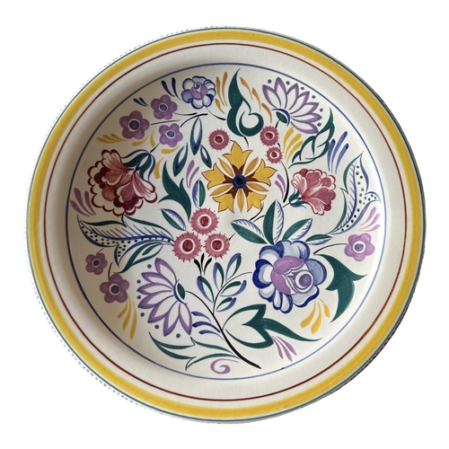 104 - A COLLECTION OF THREE 20TH CENTURY FLORAL POOLE POTTERY CHARGERS, TOGETHER WITH A FLORAL POOLE POTTE... 