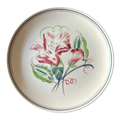 104 - A COLLECTION OF THREE 20TH CENTURY FLORAL POOLE POTTERY CHARGERS, TOGETHER WITH A FLORAL POOLE POTTE... 