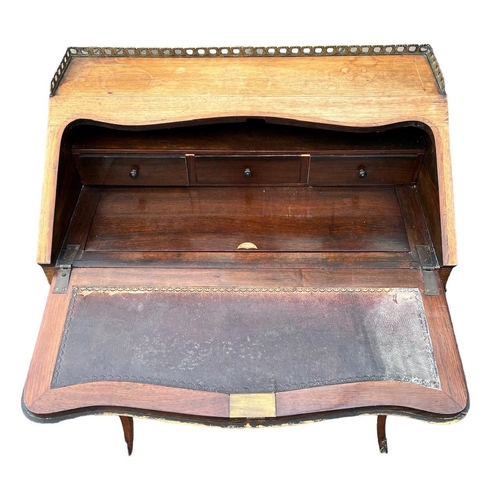 149 - A 19TH CENTURY GILT METAL MOUNTED ROSEWOOD AND MARQUETRY LADIES’ WRITING BUREAU
With gallery top abo... 