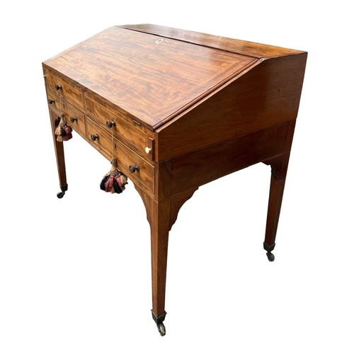 121 - AN EARLY 19TH CENTURY MAHOGANY WRITING BUREAU
The fall front opening to reveal fitted interior above... 