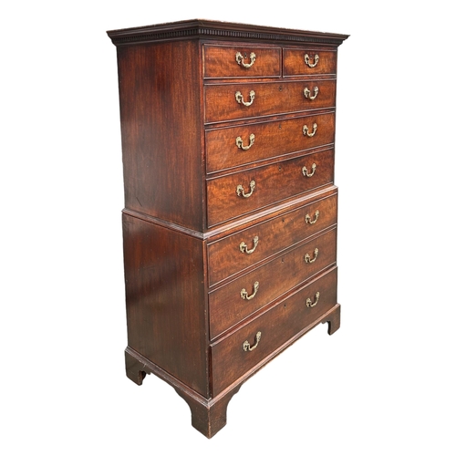 147 - A GEORGE III MAHOGANY CHEST ON CHEST 
With two short over six long graduated drawers, raised on brac... 