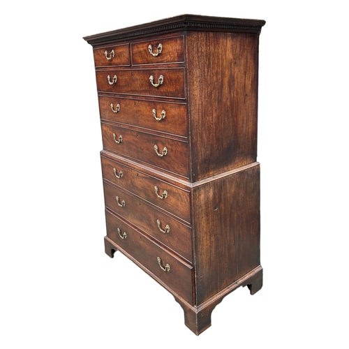 147 - A GEORGE III MAHOGANY CHEST ON CHEST 
With two short over six long graduated drawers, raised on brac... 