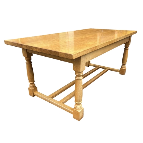 148 - STEWART LINFORD, A 17TH CENTURY DESIGN OAK REFECTORY TABLE
The five plank table supported on turned ... 