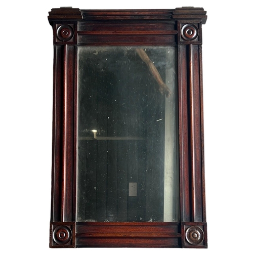 153 - A 19TH CENTURY REGENCY MAHOGANY PIER MIRROR
The central glass surrounded by four circular randles.
(... 