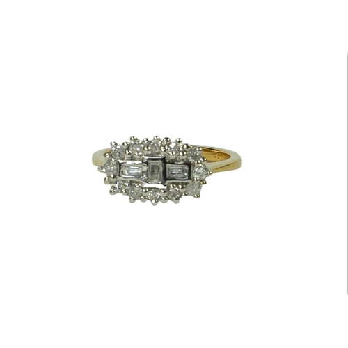 11A - AN 18CT YELLOW GOLD DIAMOND CLUSTER RING,
set with round brilliant cut and baguette cut diamonds. 
(... 