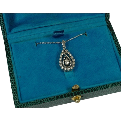 25 - A PEAR SHAPED PENDANT SET WITH ROUND CUT DIAMONDS ON A SILVER CHAIN, boxed.
(Diamonds approx. 0.24ct... 