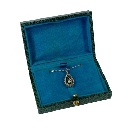 25 - A PEAR SHAPED PENDANT SET WITH ROUND CUT DIAMONDS ON A SILVER CHAIN, boxed.
(Diamonds approx. 0.24ct... 