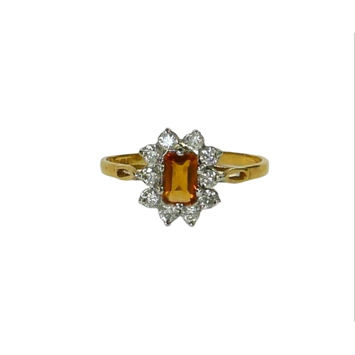 32 - AN 18CT YELLOW AND WHITE GOLD, DIAMOND AND CITRINE CLUSTER RING
Having central baguette cut citrine ... 