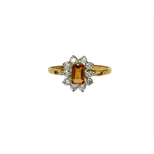 32 - AN 18CT YELLOW AND WHITE GOLD, DIAMOND AND CITRINE CLUSTER RING
Having central baguette cut citrine ... 