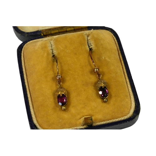 3A - A PAIR OF VICTORIAN YELLOW METAL AND GARNET EARRINGS, YELLOW METAL TESTED AS 9CT GOLD
Oval cut garne... 