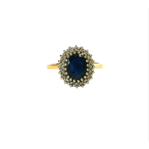 40 - AN 18CT YELLOW AND WHITE GOLD SAPPHIRE AND DIAMOND CLUSTER RING
Having central oval cut sapphire (ap... 