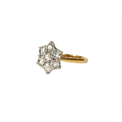 41 - AN 18CT WHITE AND YELLOW GOLD, DIAMOND SEVEN STONE DAISY STYLE CLUSTER RING,
with WGI Certificate.
(... 