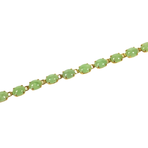 42 - A 14CT GOLD AND JADE BRACELET
Having sixteen oval cabochon cut jade inserts.
(length 8cm, gross weig... 