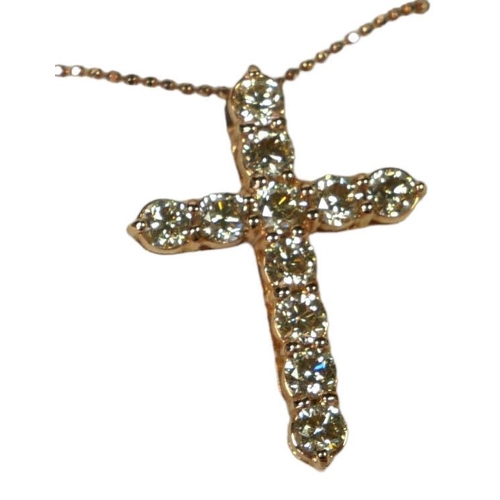 43 - An 18ct rose gold diamond cross on a silver rose coated chain, 
With WGI Certificate.
(Diamonds 2.20... 