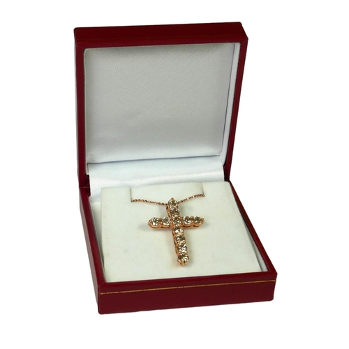 43 - An 18ct rose gold diamond cross on a silver rose coated chain, 
With WGI Certificate.
(Diamonds 2.20... 