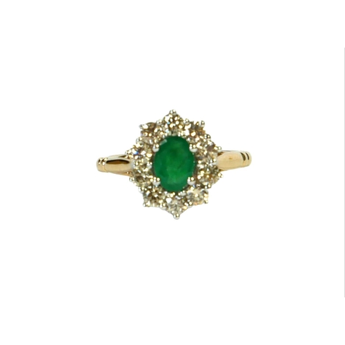 9A - A 9CT WHITE AND YELLOW GOLD, EMERALD AND DIAMOND CLUSTER RING.
(Approx Emerald 0.85ct.  Diamonds 0.9... 