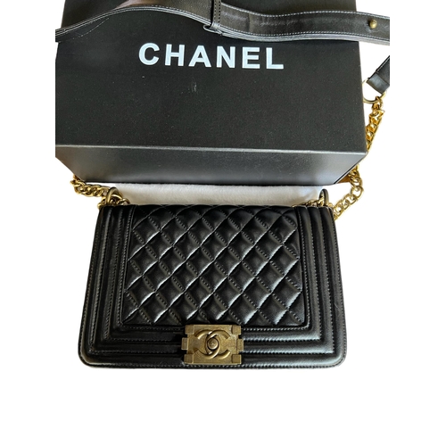 100A - CHANEL, BOY BLACK QUILTED LEATHER CROSSBODY BAG
With signature ‘CC’ logo clasp at the front, in orig... 