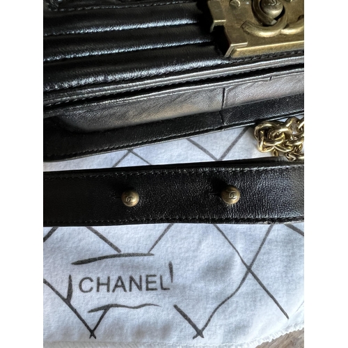 100A - CHANEL, BOY BLACK QUILTED LEATHER CROSSBODY BAG
With signature ‘CC’ logo clasp at the front, in orig... 