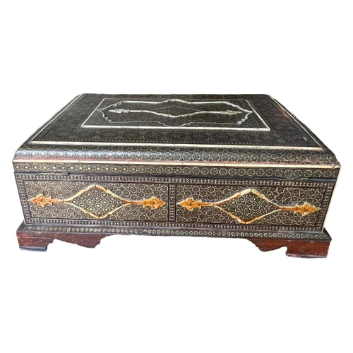 156 - A 19TH CENTURY OTTOMAN EMPIRE LACQUERED WOOD BOX
inlaid with bone and gilt metal geometrical star de... 