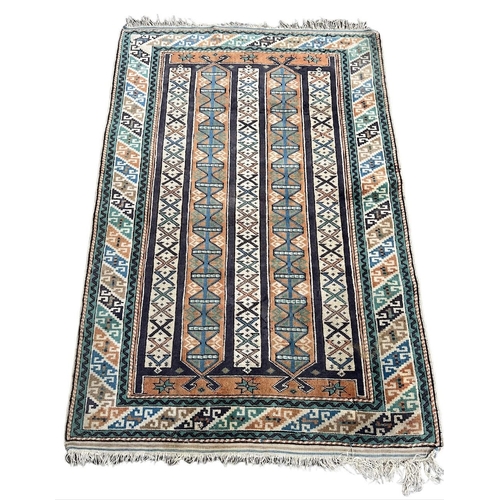 157 - A VINTAGE RUG
With multicoloured geometrical repeating motives.
(121cm x 176cm)