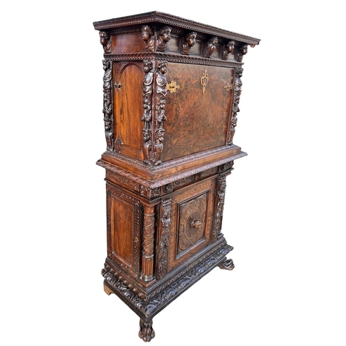 158 - A 17TH/18TH CENTURY ITALIAN CARVED WALNUT AND BURR WALNUT BAMBOCCI CABINET 
With two single drawer a... 