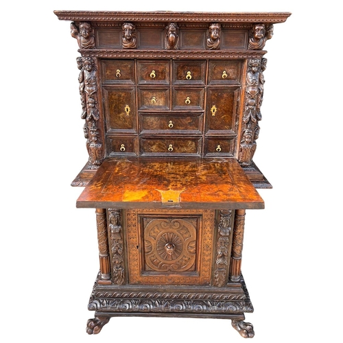 158 - A 17TH/18TH CENTURY ITALIAN CARVED WALNUT AND BURR WALNUT BAMBOCCI CABINET 
With two single drawer a... 