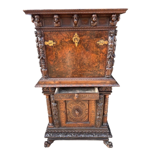 158 - A 17TH/18TH CENTURY ITALIAN CARVED WALNUT AND BURR WALNUT BAMBOCCI CABINET 
With two single drawer a... 