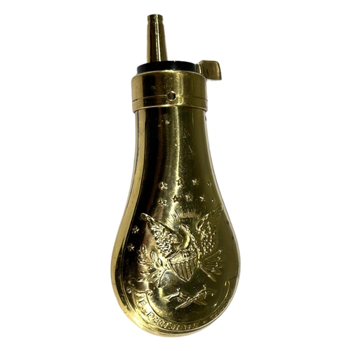 83 - A LATE 19TH EARLY 20TH CENTURY BRASS BULLET MOULD, TOGETHER WITH A LATER AMERICAN POWDER FLASK. 
(ap... 