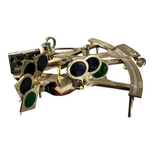 95 - A 19TH CENTURY BRASS SEXTANT HOUSED IN WOODEN CASE
Having wooden handle and green felt lined wooden ... 