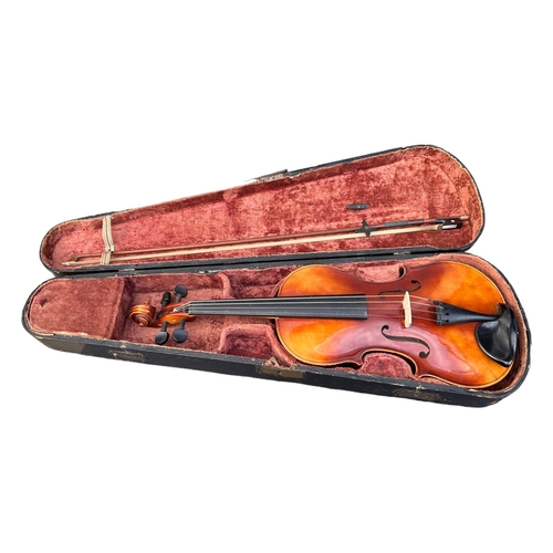 57A - A 20TH CENTURY VIOLIN AND BOW HOUSED IN A 19TH CENTURY WOODEN AND BRASS CASE
Inside label reading ‘A... 